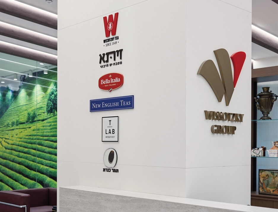 Environmental graphic design featuring custom 3D wall logos and brand wall signage by Studio Luka
