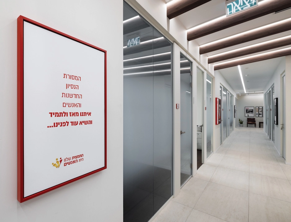 Custom framed brand values wall panel and corridor spatial branding for corporate office