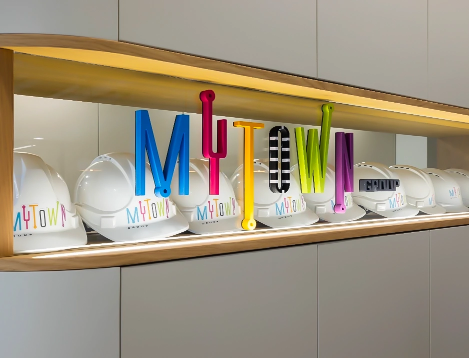3D Logo Letters on Glass Showcase with Branded Hard Hats